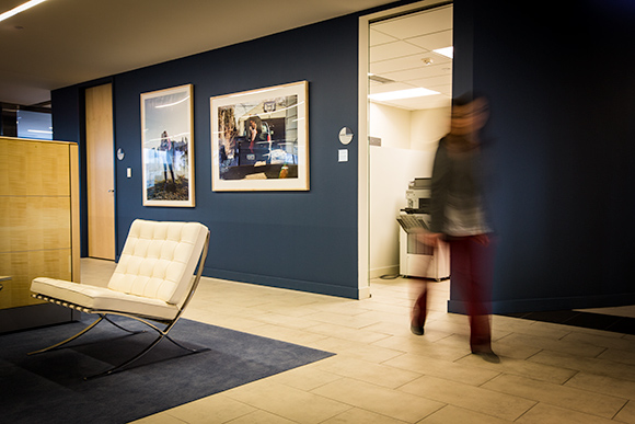 Photographs are part of the Crabrook Academy of Art exhibition on display at Mercedes-Benz Financial Services. Shown here, the art interacts with the space and the people