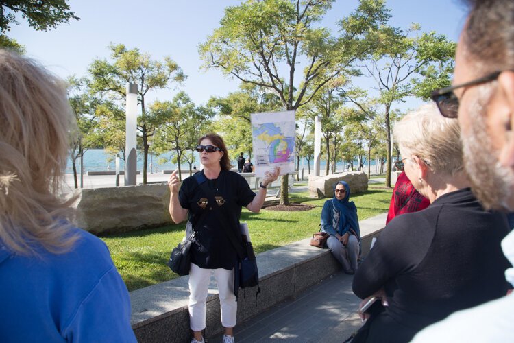 Tour guide Gwen leads a Detroit History Tour group through the city's complicated colonial past.