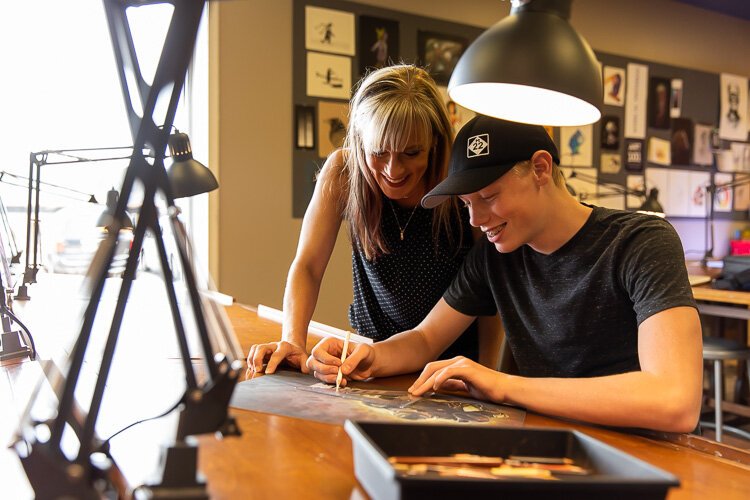 Kim Messing assists a student.