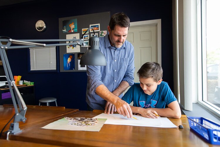 Kevin Messing assists a student.