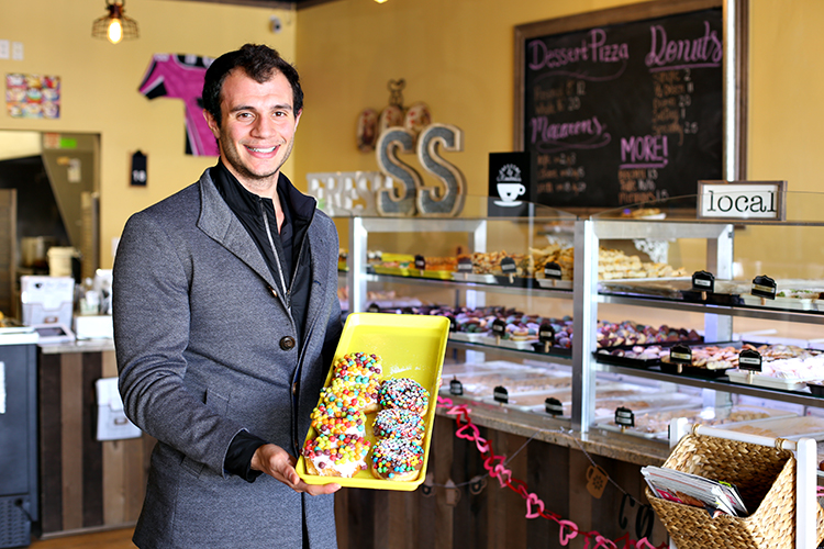 Andrew Kattula shows off the doughnuts at Street Sweets.
