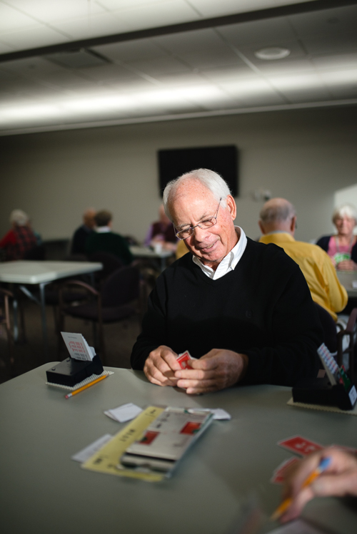 Bob Pearson plays a game of cards at Rochester Hills OPC. Photo by Steve Koss.