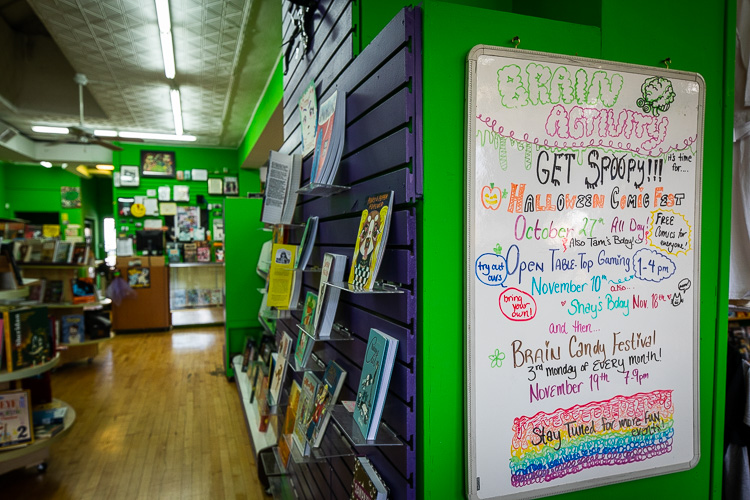 Event board at Green Brain Comics