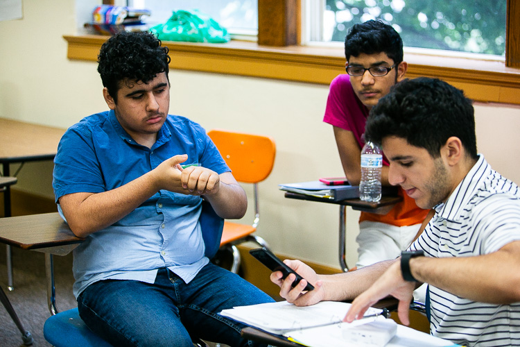 Students explore handheld air quality monitors. Photo by David Lewinski.