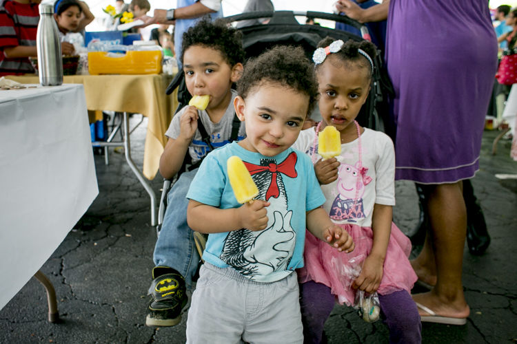 Children enjoy popsicles at the Children’s Business Fair.