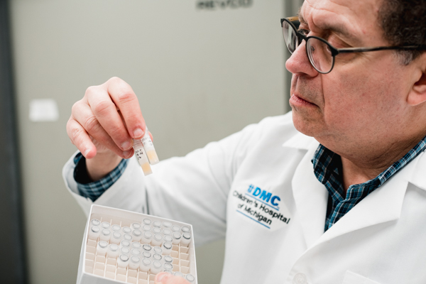 Dr. Steven Lipschultz holding frozen DNA samples