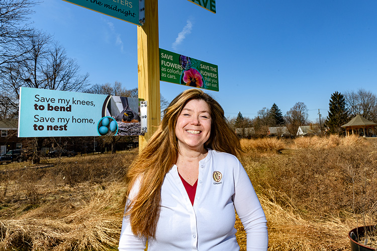 Mary Tischler at the Ginosko-built Renaissance Village Apartments, It Takes A Village Garden at Votrobeck Playground. Photo by Doug Coombe