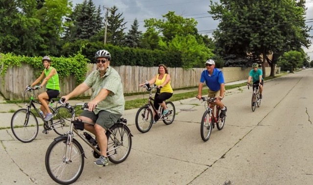 Bike Dearborn cyclists riding through a neighborhood in Dearborn