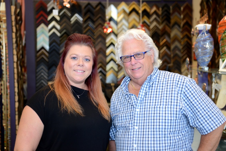 Village Picture Framing and Art Gallery owner Tom Clark and his daughter Photo by Jessica Strachan.