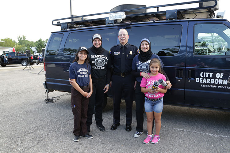 Haddad joins communigty members in the annual community-building campaign that promotes police-community partnerships.
