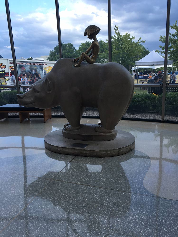 The Boy and Bear statue at its new home in the Southfield Public Library. Photo courtesy Maureen McDonald.
