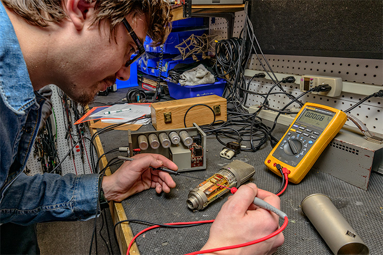 Technicians repairing equipment at Vintage King Audio in Ferndale