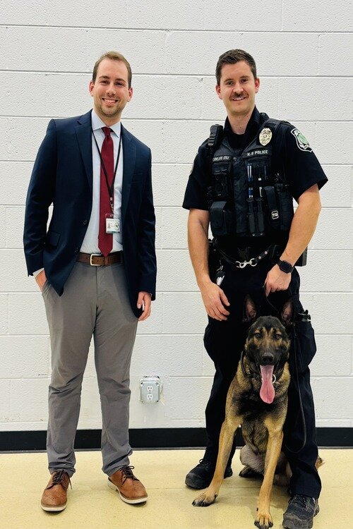 Left to Right: Adam Owczarzak with Officer Lawless and Vader.
