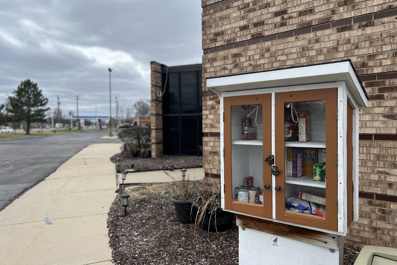 A food pantry outside of Elim Restoration.
