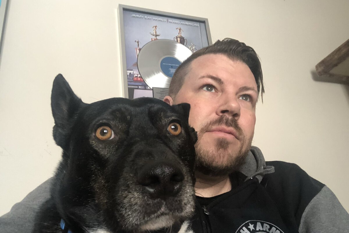 "Moxie and me hanging out in the house. Behind me is Jimmy Eat World's Platinum Record Award that was given to the record studio. I've made a habit of collecting those and I'm hoping to catch all my favorite albums."