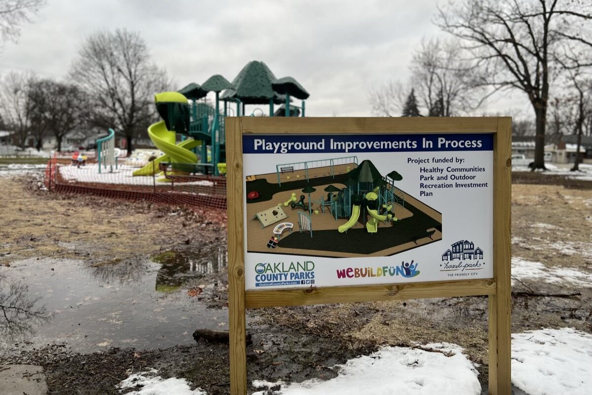 The new playscape at Green Acres Park wrapped in construction fencing.