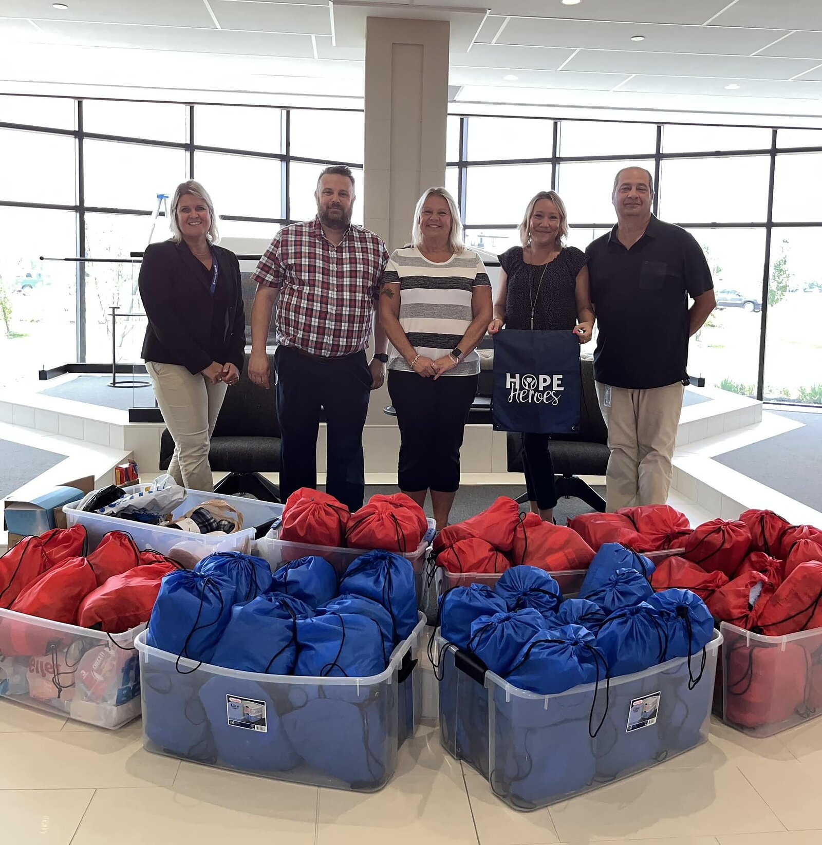 FAMILIES AGAINST NARCOTICS: Volunteers from Christian Financial Credit Union putting together and donating 80 hygiene kits to the Hope Not Handcuffs program. Credit: Courtesy of Families Against Narcotics.