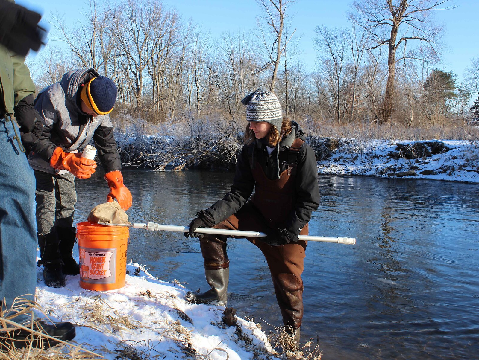 CLINTON RIVER WATERSHED COUNCIL: A volunteer taking samples out of the Clinton River Watershed for winter Stonefly research. Credit: Courtesy of Clinton River Watershed Council. 