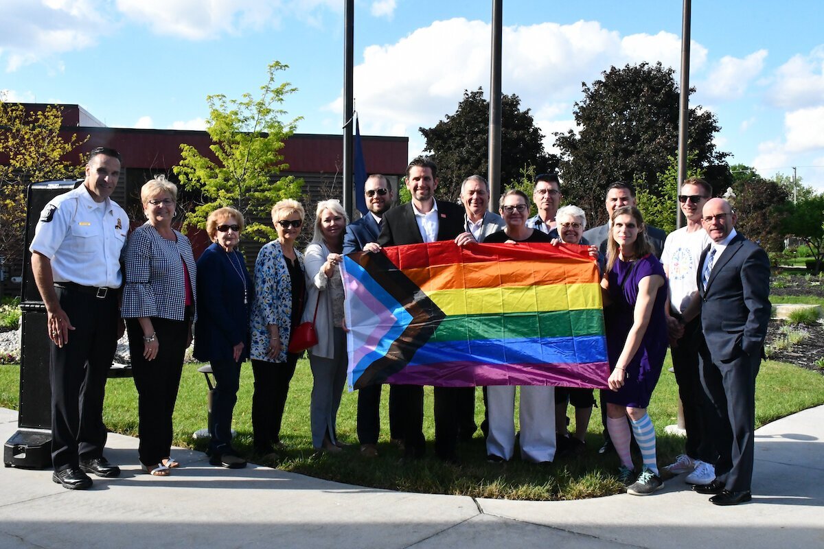 Sterling Heights Mayor and City Council, Sterling Heights Administration, members of the Sterling Heights CommUNITY Alliance and members of Macomb County Pride raise the Pride flag at Sterling Heights City Hall for Pride month in June 2022. (Photo courtesy of Sterling Heights)