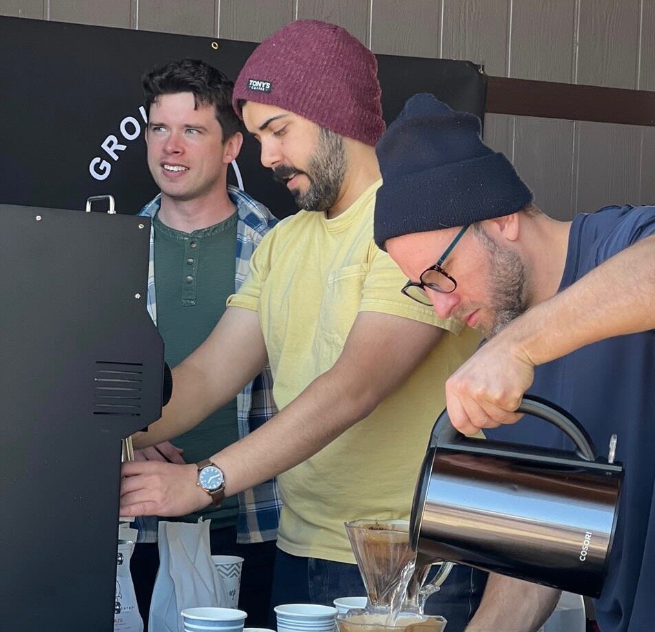 The owners of Ground Control Coffee Roasters serving coffee at the Farmington Farmers & Artisans Market (L to R): Trent Chapman, Brandon Sharp, and James McLaughlan. (Photo courtesy of Andréa Lima)
