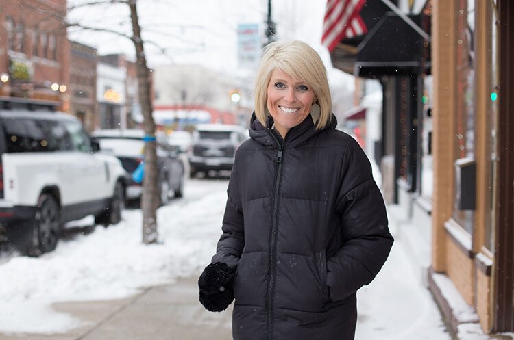 Oxford DDA director Kelly Westbrook visits the Lake Orion downtown during the festival. 