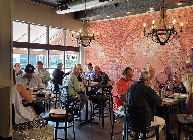 The cellar room at Cellar 104 Boutique Winery draws a crowd. Photo supplied / David Gagnon.