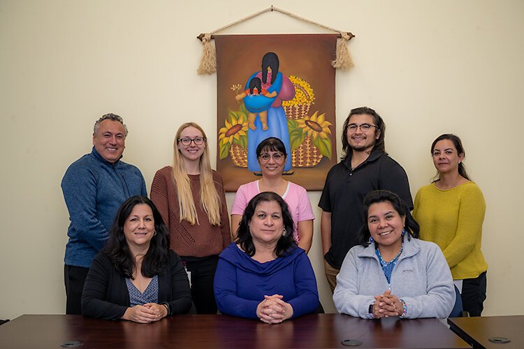 Team members of the Centro Multicultural La Familia, standing from left, Luis Mendieta, Christina Root, Margarita Ovalle, Derek DeVees and Vanda Pio, and sitting, from left, Miriam MacLean, Dr. Sonia Acosta and Dr. Eva Palma Ramirez. Photo: Doug Coombe.