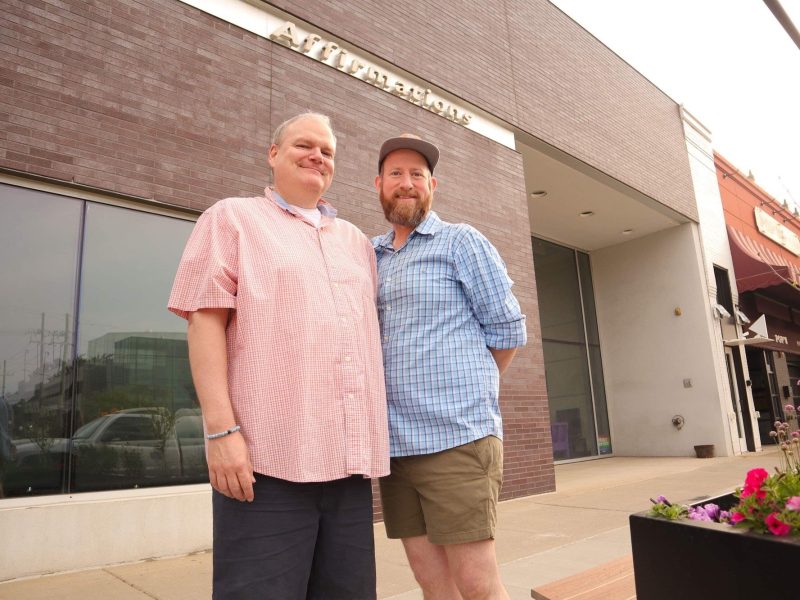 Artistic director Joe Bailey(left) stands beside his husband and theater co-founder Brandy Joe Plambeck(right). Plambeck is the media director for The Ringwald Theatre.