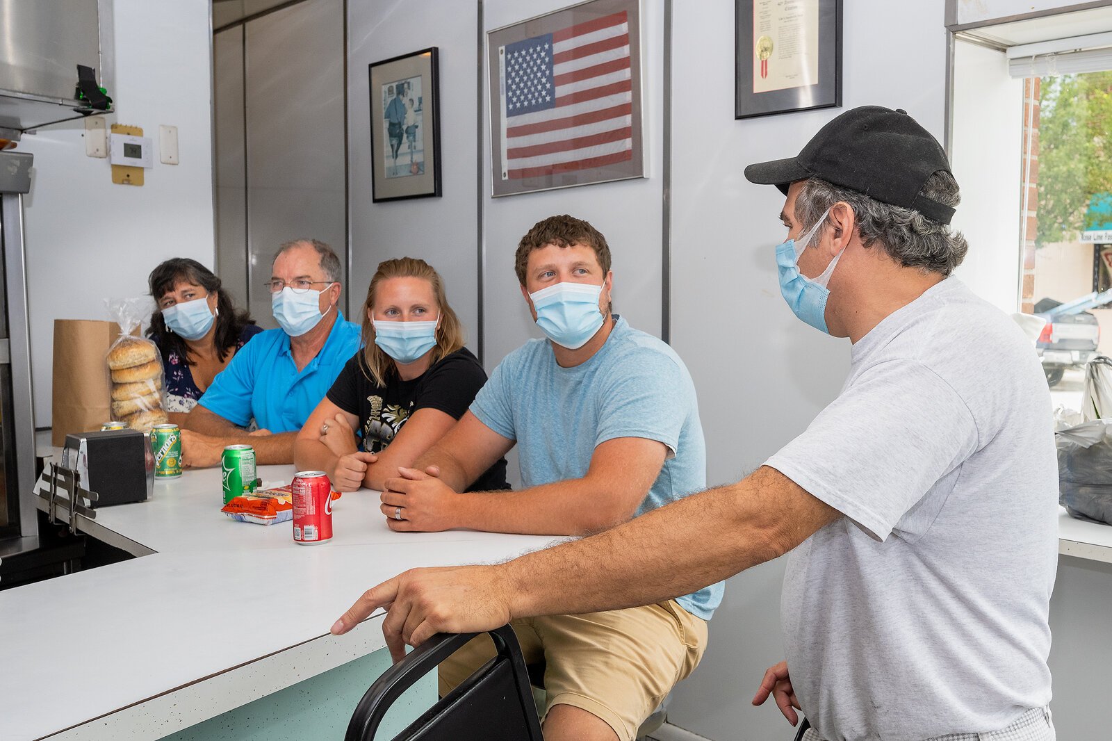 Jan, Tim, Katie, and Daniel Wyant drove from Kokomo, Indiana to buy sandwiches at Lile's to celebrate Daniel's completion of his education masters degree. Photo by Doug Coombe.