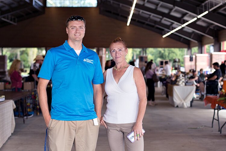 Troy Nowotny, recreation supervisor, and market manager Jean Smith at last year's Dodge Park farmer's market.