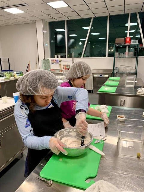Students prepare food.