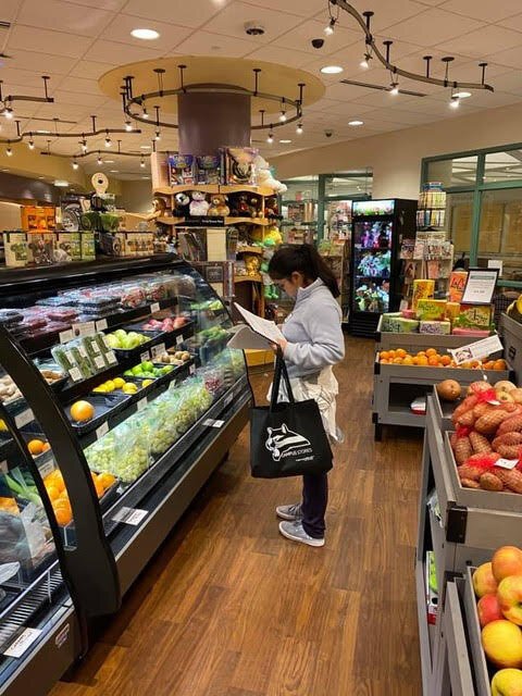 A student shops at Bronson Hospital's micro-grocery.