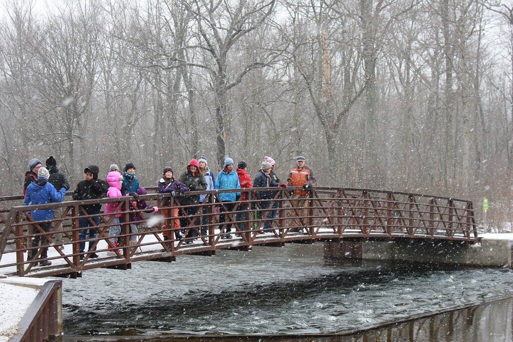 Phil Crookshank leads a hike at Proud Lake State Recreation Area for the Sierra Club. Photo by Jeff Burtka.