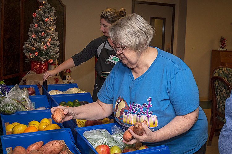 Orchard Terrace residents browse Veggie Mobile produce.
