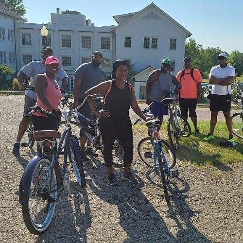 Bicyclists pose near Nankin Mills Park