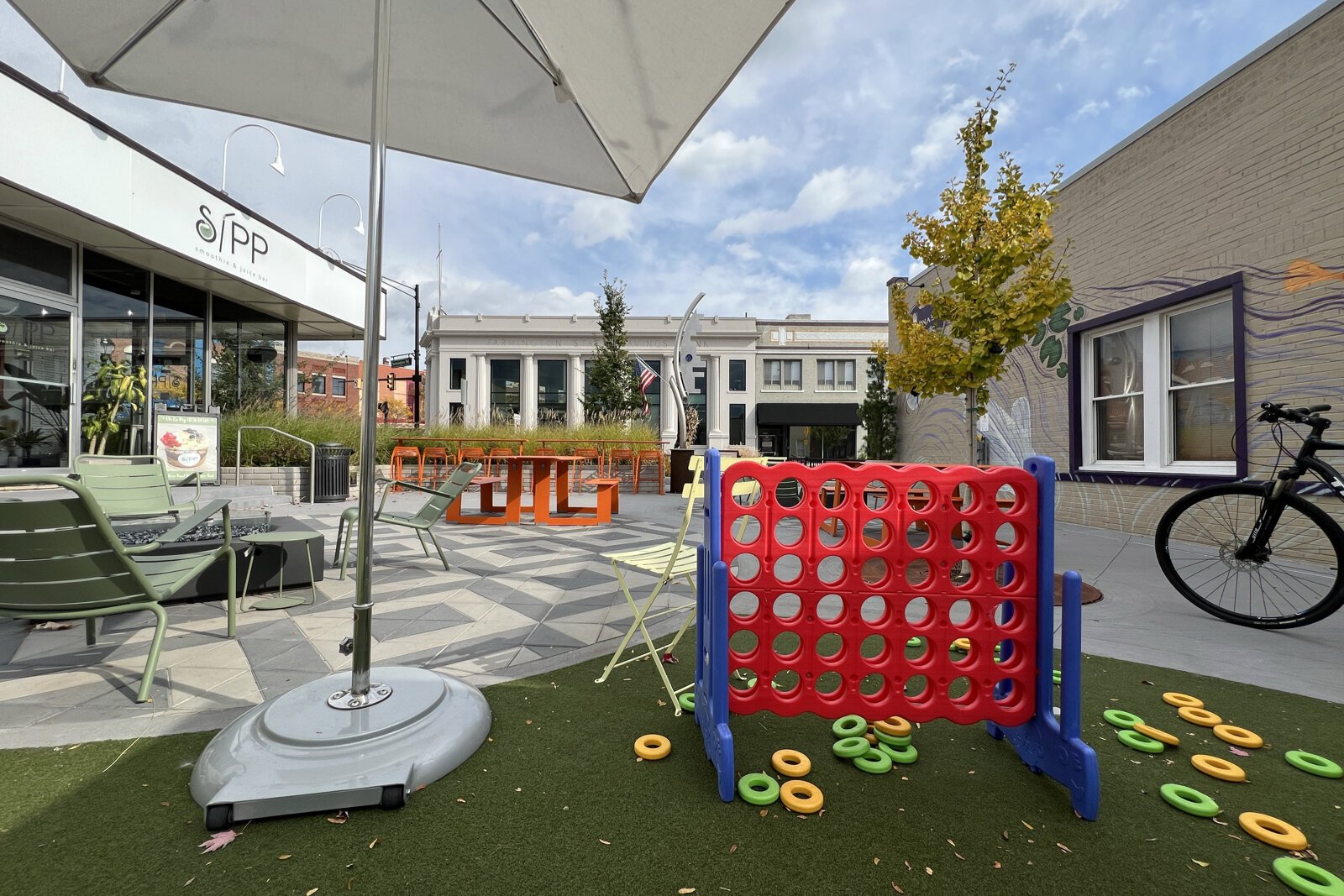 Next to Sipp Smoothie & Juice Bar is Dinan Park, shown as it's activated in warmer months.