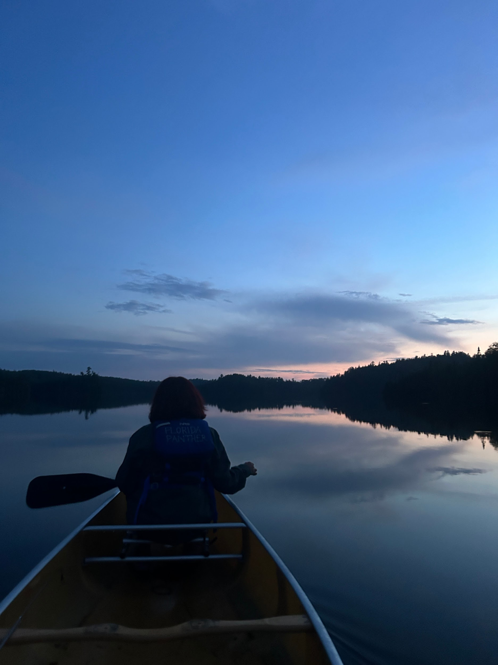 Student Mads Martinez joins Detroit Outdoors instructor Isaac Piepszowski on a sunset paddle in the Boundary Waters region of Ontario.