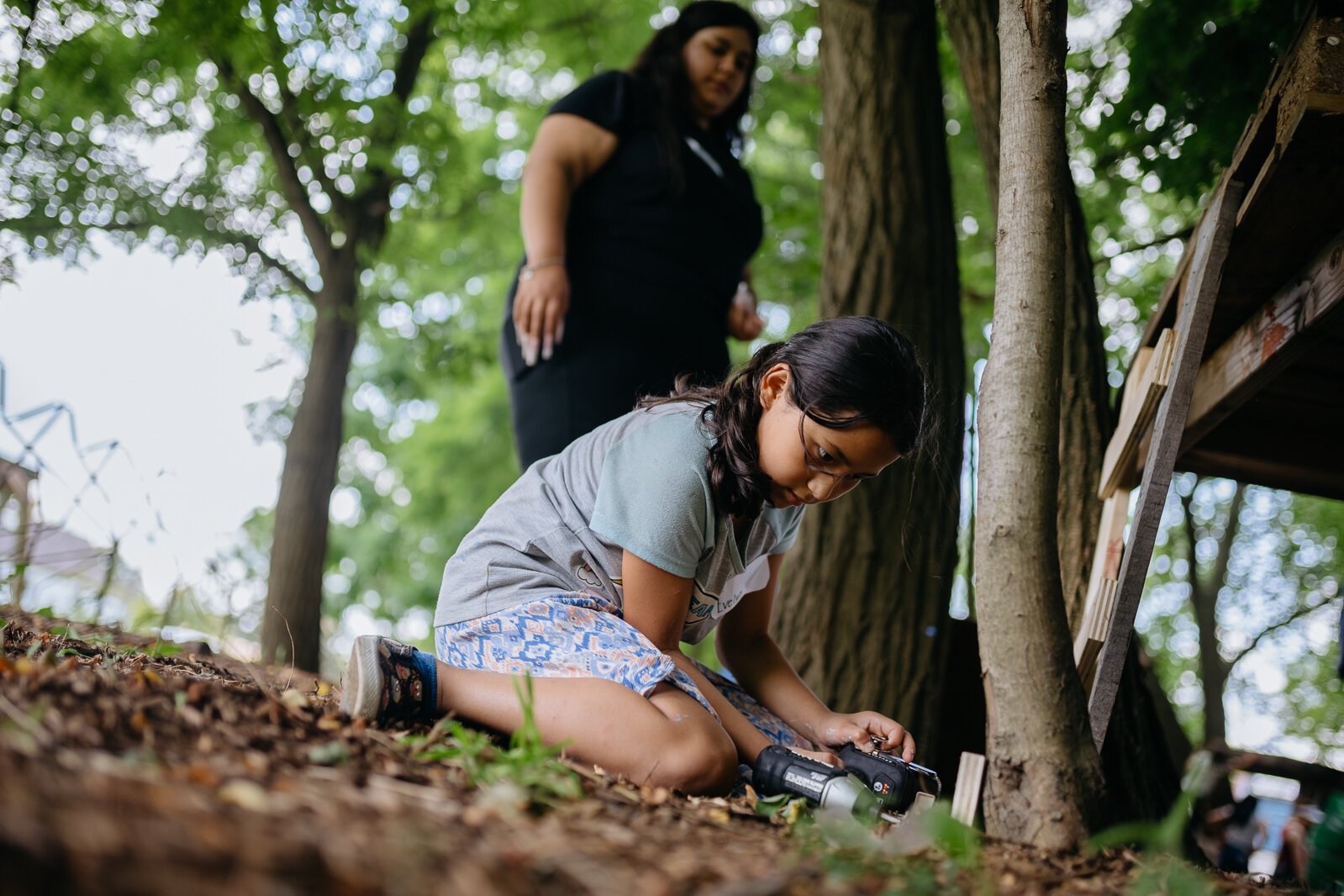 A Camp Carpenter participant works on a project.