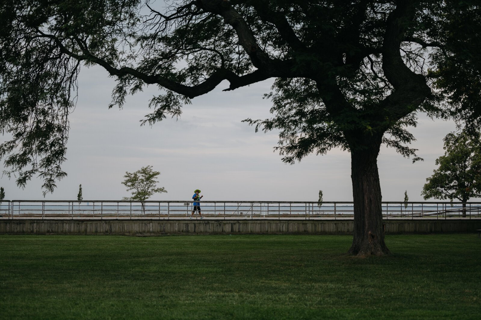 A person walks at Lake St. Clair Metropark.